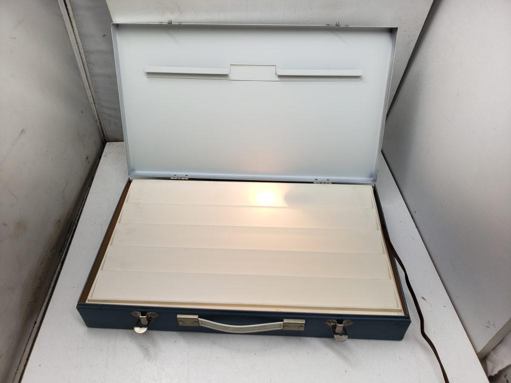 Slide sorter - metal case with a light bulb - light box
