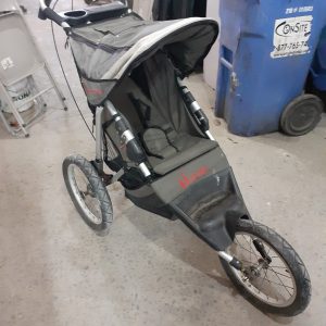 InStep three-wheeled Jogging Stroller with a canopy and pneumatic tires